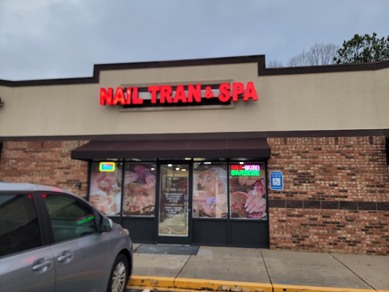 Nail Tran and Spa storefront with signature red neon signage